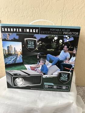 1006923 Sharper Image Portable Entertainment Projector Displays Up To 120 Inch Read