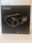 Nib Jinhoo Mini Projector White With A Projection Screen PJ0551. Fixed Price $48.75.