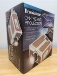Brookstone On-the-go Projector For Use With Both Ios Android Smart Phones. Fixed Price $12.50.