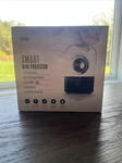 New Box Smart Portable Mini Projector 1080P Hd Apple Android Compatible. Fixed Price $38.99.