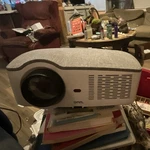Onn. Home Theater Projector Gray, White. Fixed Price $35.00.