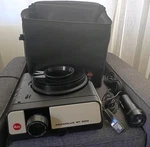 Leitz Pradolux Rt 300 35MM Slide Projector W/ Case, Remote, Carousel, Lenses. Fixed Price $171.77.