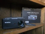 Wimius 1080P Led Projector Model K1 5G Wifi Bluetooth 5.2 4P 4D Keystone 50. Fixed Price $150.00.