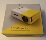Artlii Mini Led Video Projector 1080 Pixels Box Accessories Includes Remote. Fixed Price $15.99.