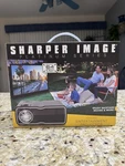 Sharper Image Portable Entertainment Projector, Display's Up 100. Fixed Price $45.00.