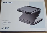 Aurzen Zip Tri-fold Ultra Portable Projector Dark Gray DZ001. Fixed Price $229.99.