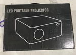 Jifar Led- Portable Projector. Fixed Price $65.99.