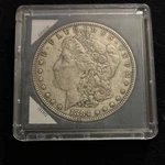 1884 Morgan Silver Dollar $1 Circulated Uncertified In Protective Case. Fixed Price $72.00.