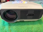 New Cooau A4300 Portable Movie Projector 5500 Lumens 1080P Home Theater White. Fixed Price $49.00.