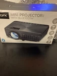 Gpx Mini Projector --2000 Lumens With Bluetooth And Remote. Fixed Price $25.00.