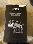 Xgody - GIMBAL5 Smart Mini Android 11 Projector Full 1080P Hd. Fixed Price $69.99.