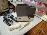 SM400 Singer Slide And Film Strip Projector - With Bulb Extras. Fixed Price $75.00.