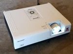 White Sharp PG-D2510X Pc 3D Ready Dlp 4:3 1080P Hd Projector W/ Power Cord. Fixed Price $50.00.
