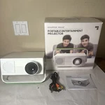 Sharper Image Portable Entertainment Projector Display's Up 120 Inch Screen. Fixed Price $39.99.