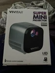 Vivitar Super Mini Projector 1080P, Led. Support Fhd. New Box Gray. Fixed Price $38.99.