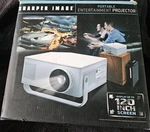 New Sharper Image Portable Entertainment Projector EC-PJ10 Up 120". Fixed Price $49.95.
